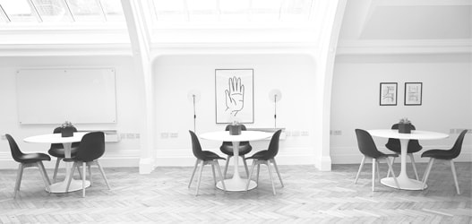 Modern interior with three tables and chairs